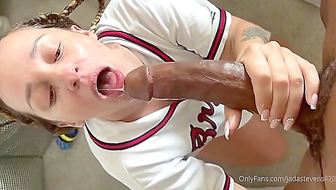 Hot brunette with a tattooed body sucks a black cock