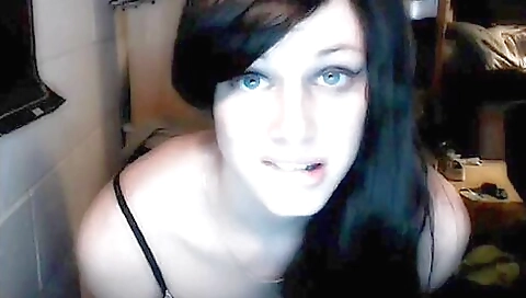 Slutty brunette in a black dress with tight ass shows her body