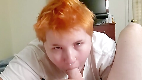 Busty redhead with a tattoo on her face fucks in POV